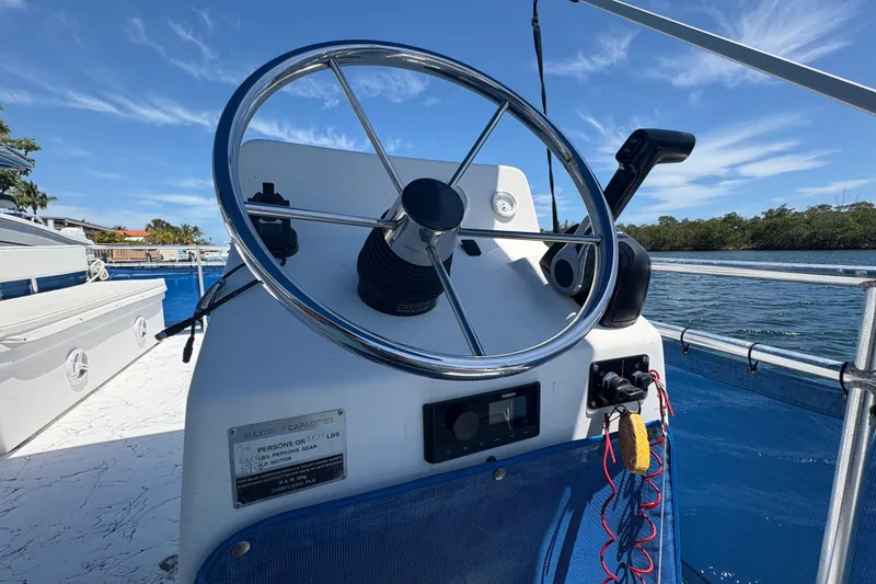 Slide: The Image of Steering wheel of 2021 A&M Manufacturing Salty boat on water. - 19