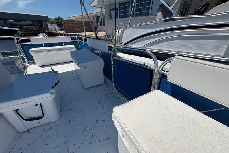 Slide: The Image of 2021 A&M Manufacturing Salty boat deck with seating and storage compartments. - 28