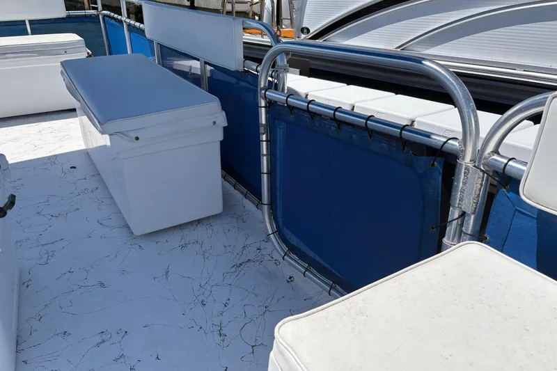 Slide: The Image of 2021 A&M Manufacturing Salty boat interior with white seating and blue accents. - 29