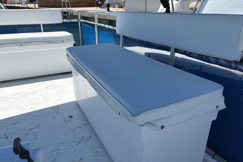 Slide: The Image of 2021 A&M Manufacturing Salty boat with white cushioned seating on deck. - 30