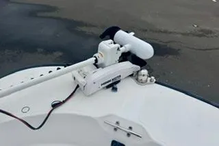 Slide: The Image of 2014 Boston Whaler Montalk boat with mounted trolling motor on deck. - 10