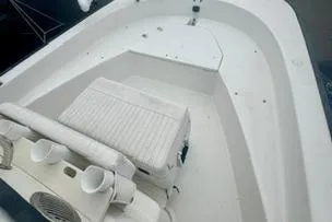 Slide: The Image of 2014 Boston Whaler Montalk boat interior with seating and storage compartments. - 11