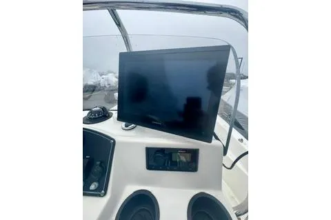Slide: The Image of 2014 Boston Whaler Montalk boat dashboard with mounted screen and controls. - 13