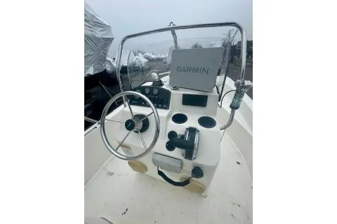 Slide: The Image of 2014 Boston Whaler Montalk boat console with Garmin navigation system. - 14