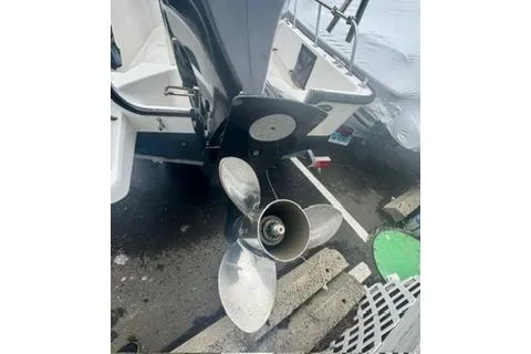 Slide: The Image of Boston Whaler Montalk 2014 boat propeller and stern in a marina setting. - 7