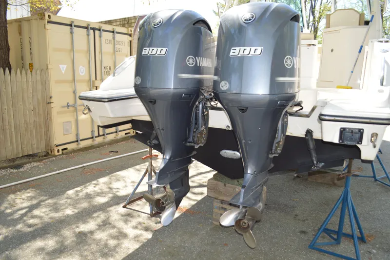 Slide: The Image of 2018 Pursuit DC 295 Dual Console with twin Yamaha 300 outboard engines. - 7