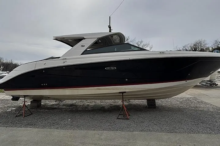 The Image of 2023 Sea Ray SLX 400 boat on stands, side view, outdoors. - 0