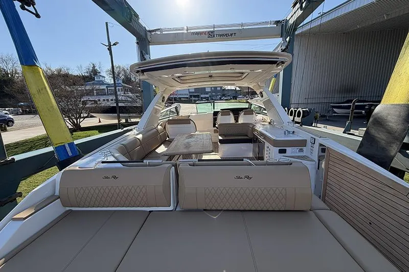 Slide: The Image of 2023 Sea Ray SLX 400 luxury boat interior with spacious seating and elegant design. - 10