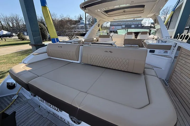 Slide: The Image of 2023 Sea Ray SLX 400 luxury boat with spacious seating and elegant design. - 11