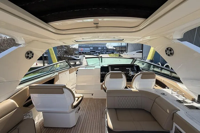 Slide: The Image of Interior view of 2023 Sea Ray SLX 400 luxury boat with modern seating and controls. - 25