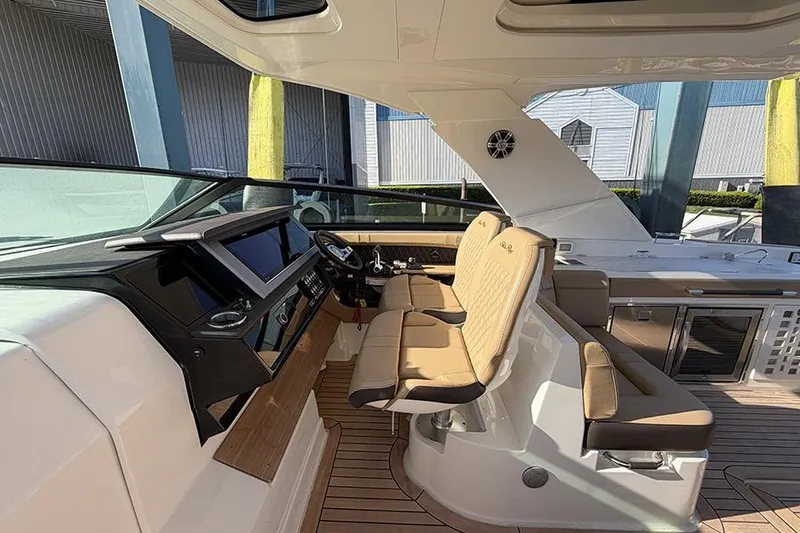 Slide: The Image of Interior view of 2023 Sea Ray SLX 400 boat with modern helm and seating. - 27