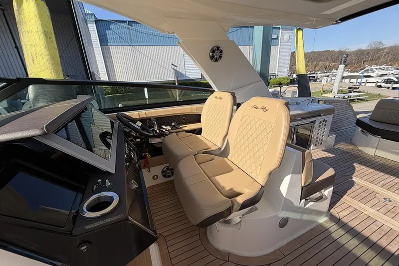 Slide: The Image of 2023 Sea Ray SLX 400 yacht interior with luxurious seating and modern helm. - 28