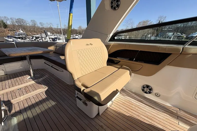 Slide: The Image of Luxurious interior of 2023 Sea Ray SLX 400 yacht with tan seating and wooden flooring. - 32