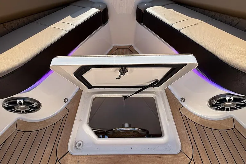 Slide: The Image of 2023 Sea Ray SLX 400 boat interior with open storage hatch and seating. - 41