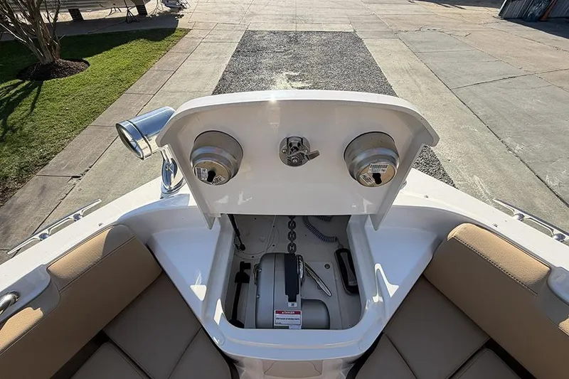 Slide: The Image of 2023 Sea Ray SLX 400 boat anchor compartment with winch and chain storage. - 42