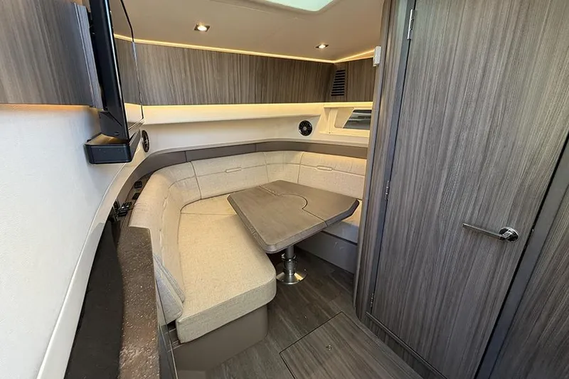 Slide: The Image of Interior of 2023 Sea Ray SLX 400 yacht with modern seating and table. - 44