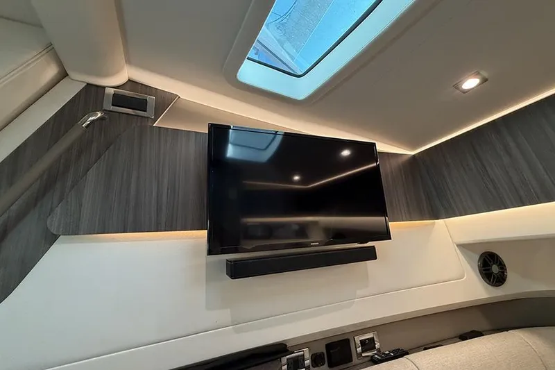 Slide: The Image of Interior of 2023 Sea Ray SLX 400 yacht with TV and skylight. - 46