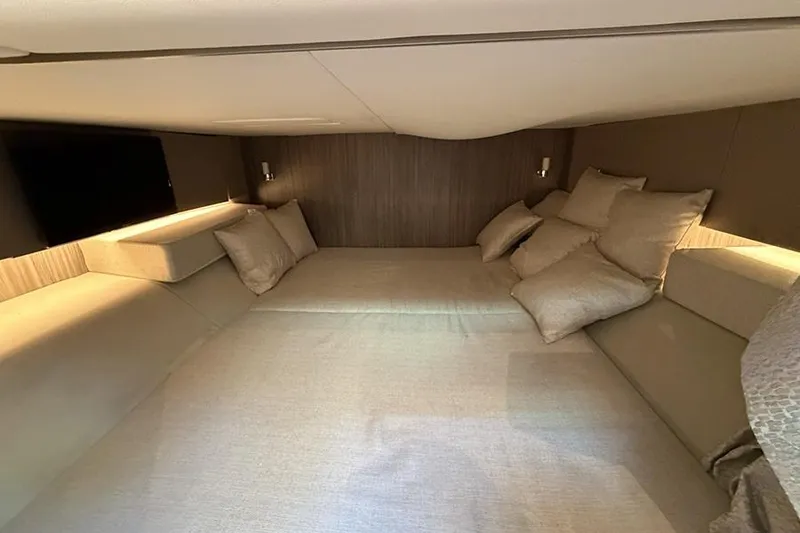 Slide: The Image of Luxurious cabin interior of 2023 Sea Ray SLX 400 yacht with plush bedding. - 52