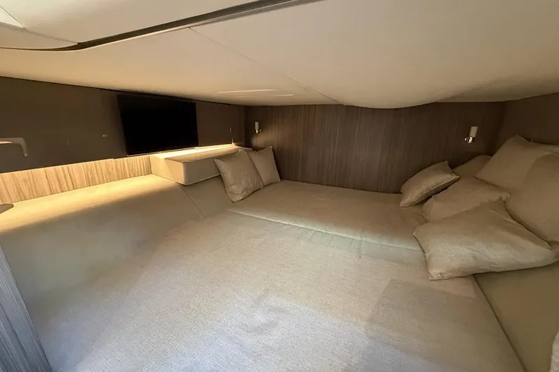 Slide: The Image of Luxurious cabin interior of 2023 Sea Ray SLX 400 yacht with cozy bedding. - 53