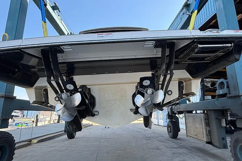 Slide: The Image of 2023 Sea Ray SLX 400 boat with dual propellers on a lift. - 6