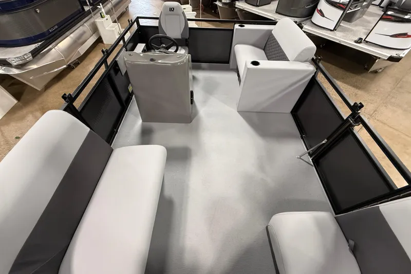 Slide: The Image of 2026 Angler Quest 7515 Leisure Quest Cruise interior with seating and steering console. - 12