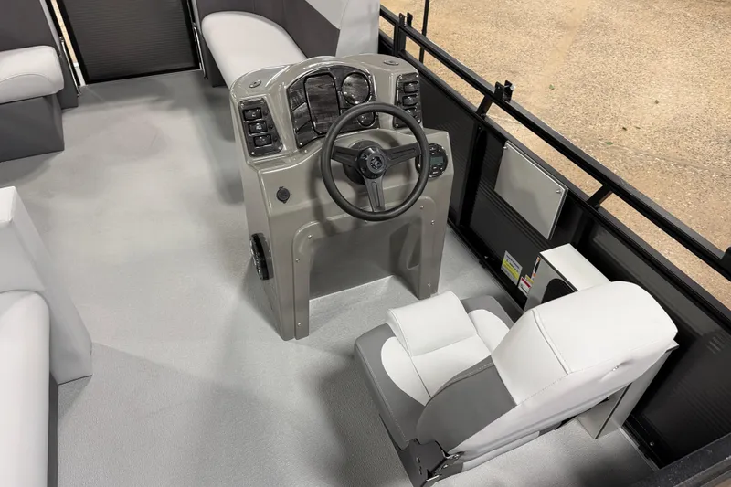 Slide: The Image of 2026 Angler Quest 7515 Leisure Quest Cruise boat interior with steering console and seating. - 7