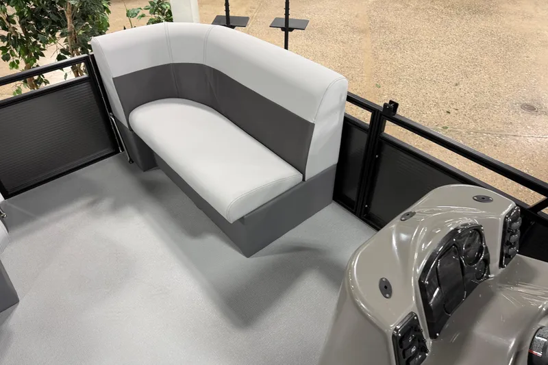 Slide: The Image of 2026 Angler Quest 7515 Leisure Quest Cruise interior with gray seating and console. - 9