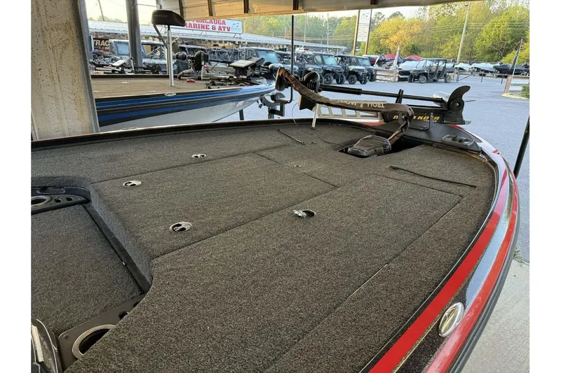 Slide: The Image of 2020 Nitro Z18 boat deck with carpeted surface and trolling motor in a showroom. - 4
