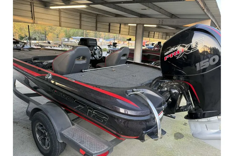 Slide: The Image of 2020 Nitro Z18 boat with Mercury Pro XS 150 engine in covered storage. - 8