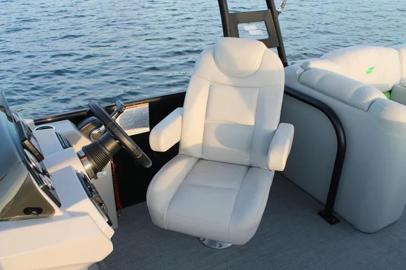 Slide: The Image of Manufacturer Provided Image: Captain's chair on a 2018 Starcraft SLS 3 boat, steering wheel visible. - 11