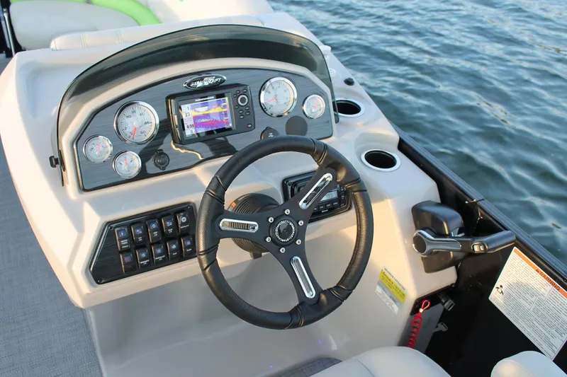 Slide: The Image of Manufacturer Provided Image: 2018 Starcraft SLS 3 boat dashboard with steering wheel and control panel on water. - 12
