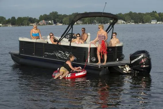 Slide: The Image of Manufacturer Provided Image: 2018 Starcraft SLS 3 pontoon boat with people enjoying water activities. - 14