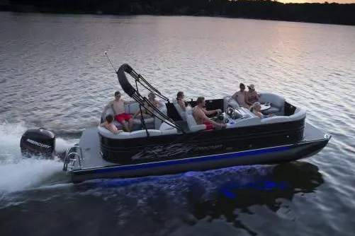 Slide: The Image of Manufacturer Provided Image: 2018 Starcraft SLS 3 pontoon boat cruising on a lake at sunset. - 15