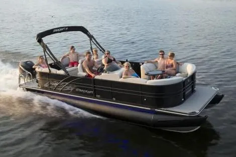 Slide: The Image of Manufacturer Provided Image: 2018 Starcraft SLS 3 pontoon boat cruising with passengers on a lake. - 16