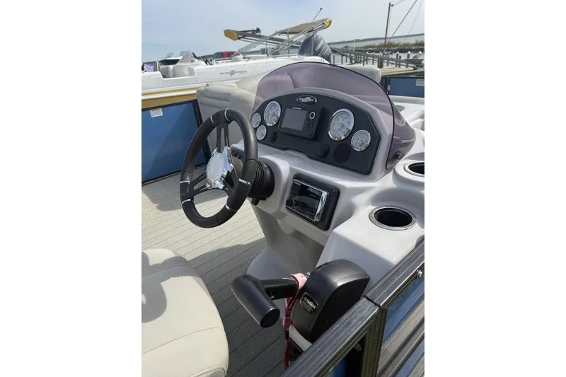 Slide: The Image of 2018 Starcraft SLS 3 boat dashboard with steering wheel and control panel. - 3