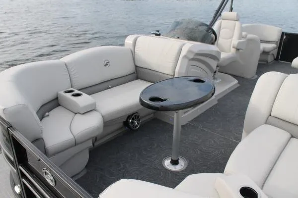 Slide: The Image of Manufacturer Provided Image: 2018 Starcraft SLS 3 boat interior with plush seating and a central table. - 9