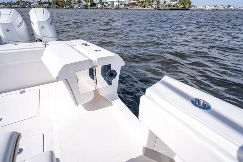 Slide: The Image of 2024 Bahama 41 boat deck with ocean view and powerful engines. - 13