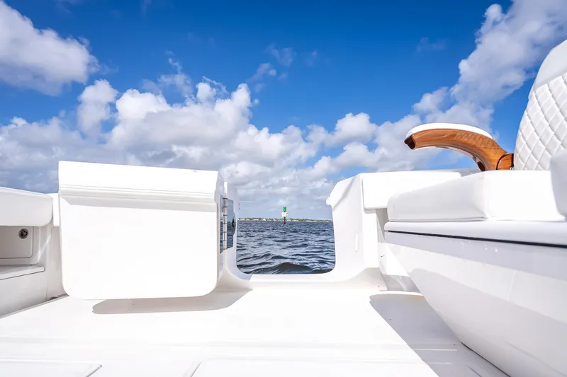 Slide: The Image of 2024 Bahama 41 boat deck with ocean view under blue sky. - 14