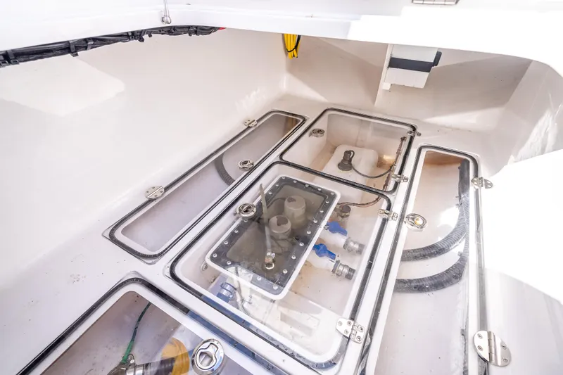 Slide: The Image of 2024 Bahama 41 boat interior showing storage compartments and mechanical components. - 17
