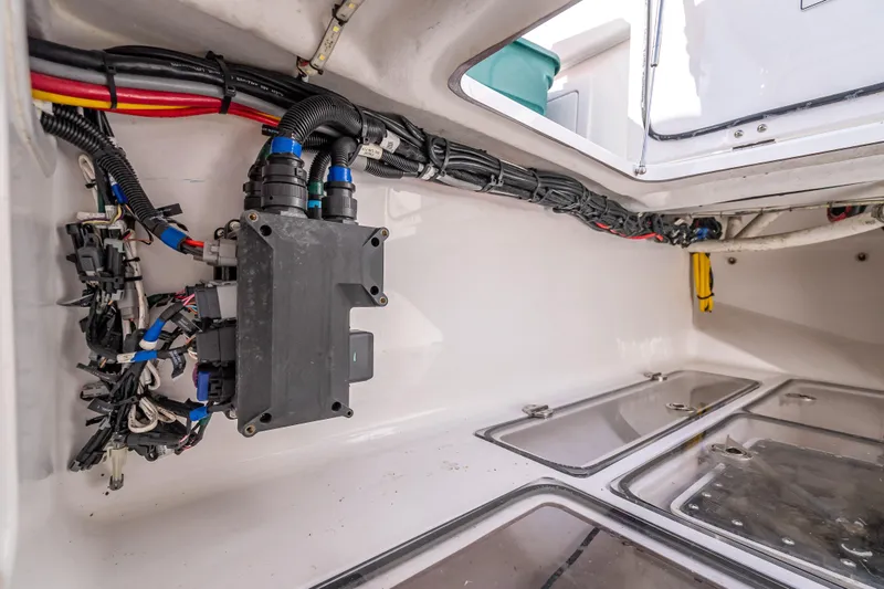 Slide: The Image of Electrical wiring and components inside a 2024 Bahama 41 boat compartment. - 18