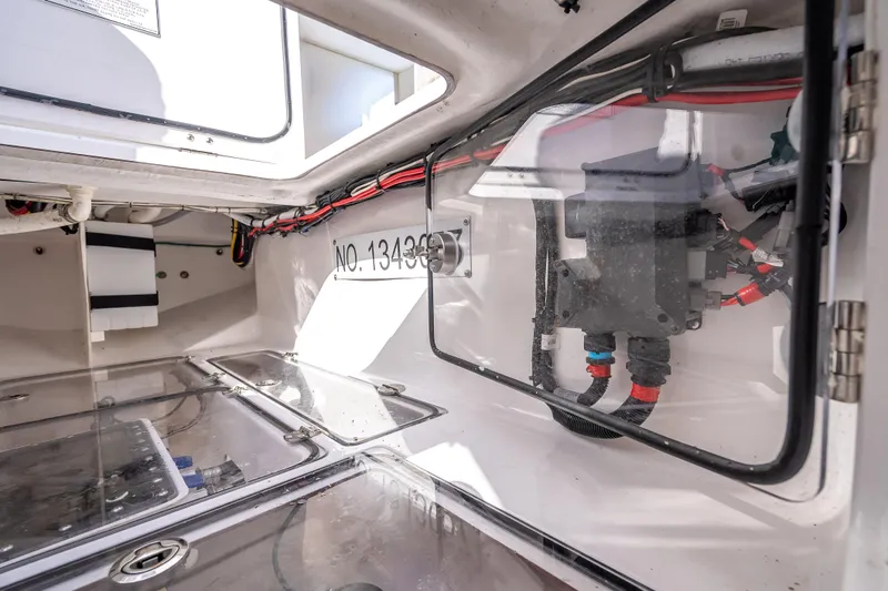 Slide: The Image of Interior view of 2024 Bahama 41 boat's electrical compartment with wiring and components. - 19