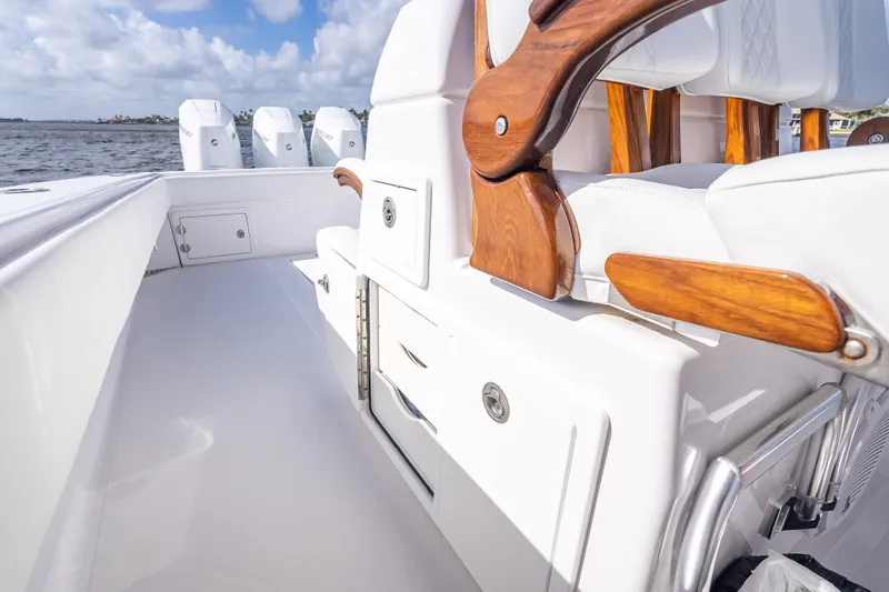 Slide: The Image of 2024 Bahama 41 boat interior with wooden accents and storage compartments. - 23