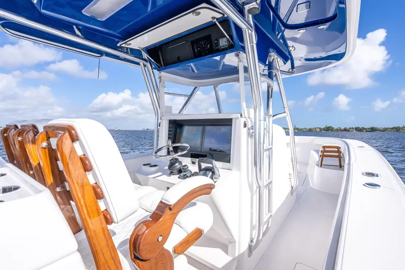 Slide: The Image of 2024 Bahama 41 boat interior with sleek design, advanced controls, and ocean view. - 25