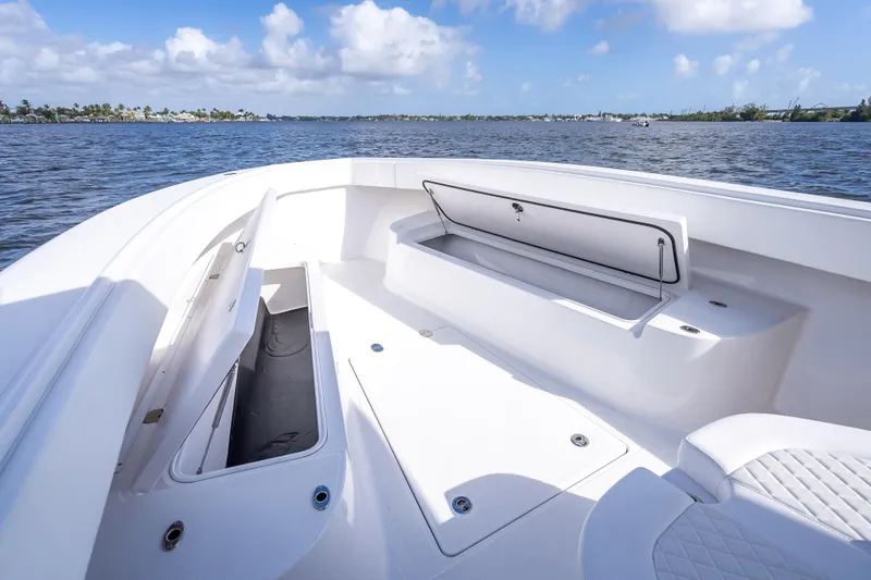 Slide: The Image of 2024 Bahama 41 boat interior with open storage compartments, on a sunny day at sea. - 30