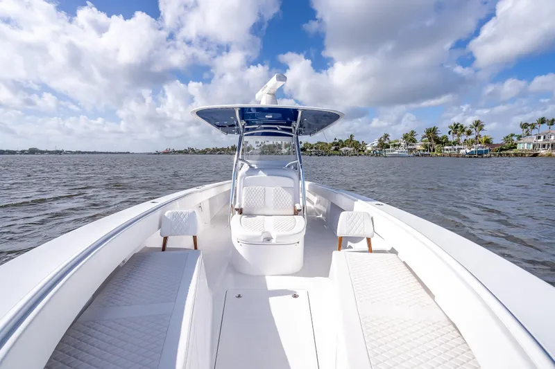 Slide: The Image of 2024 Bahama 41 boat on water, featuring sleek design and spacious deck. - 36