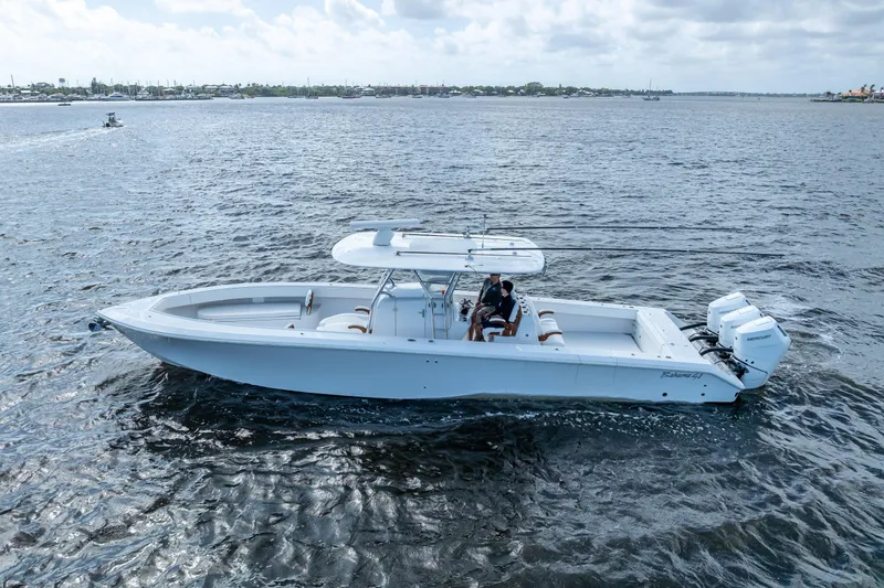 Slide: The Image of 2024 Bahama 41 boat cruising on open water under a cloudy sky. - 7
