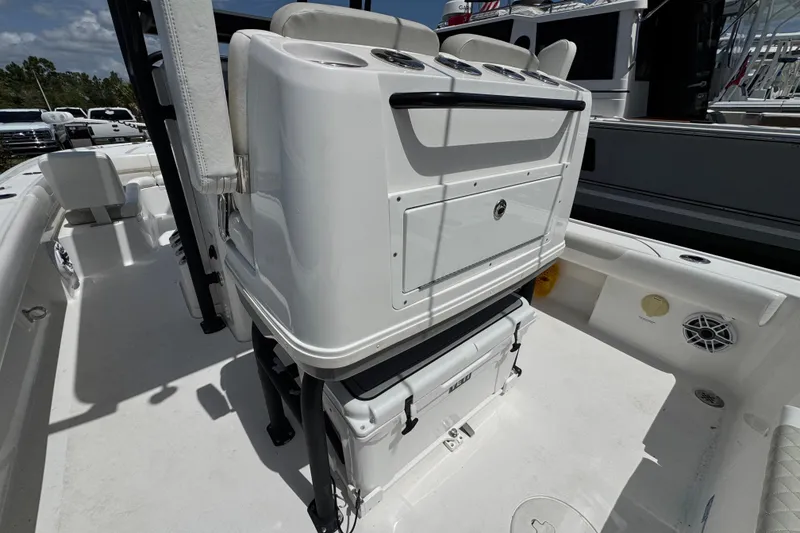 Slide: The Image of 2022 Caymas 26 HB boat interior with seating and storage compartments. - 10