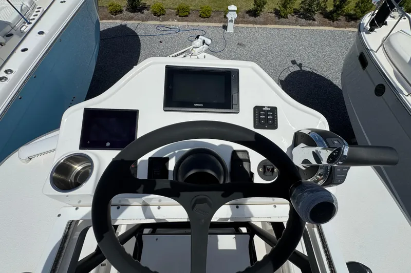 Slide: The Image of Steering console of 2022 Caymas 26 HB boat with navigation equipment. - 20
