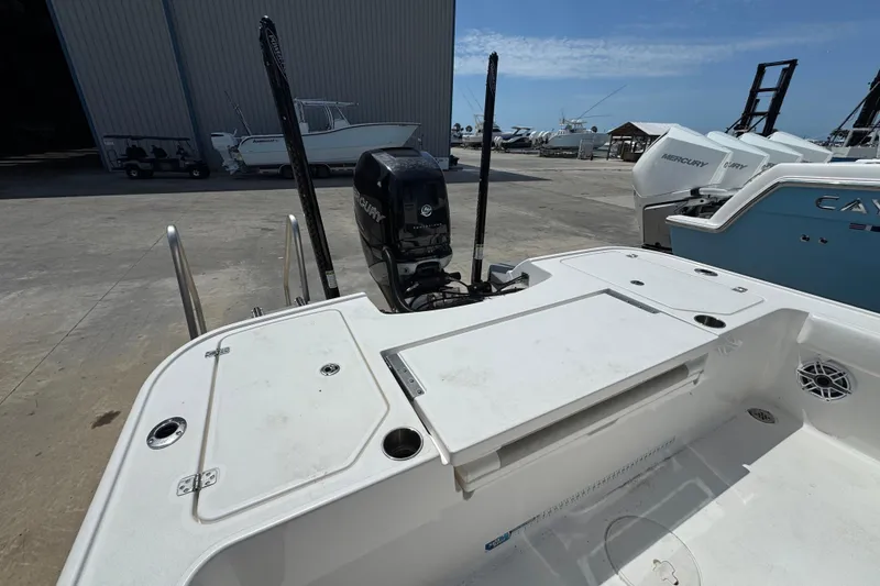 Slide: The Image of 2022 Caymas 26 HB boat with Mercury engine at a marina. - 7