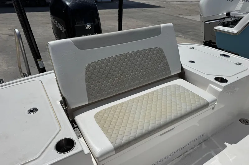 Slide: The Image of 2022 Caymas 26 HB boat seat with quilted upholstery and cup holders. - 8